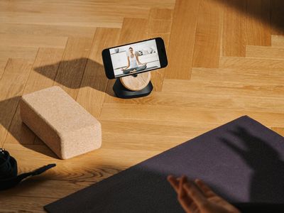Balanced stones on a wooden floor in a studio.